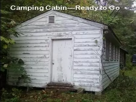 16 Acres with Trailer and Barns